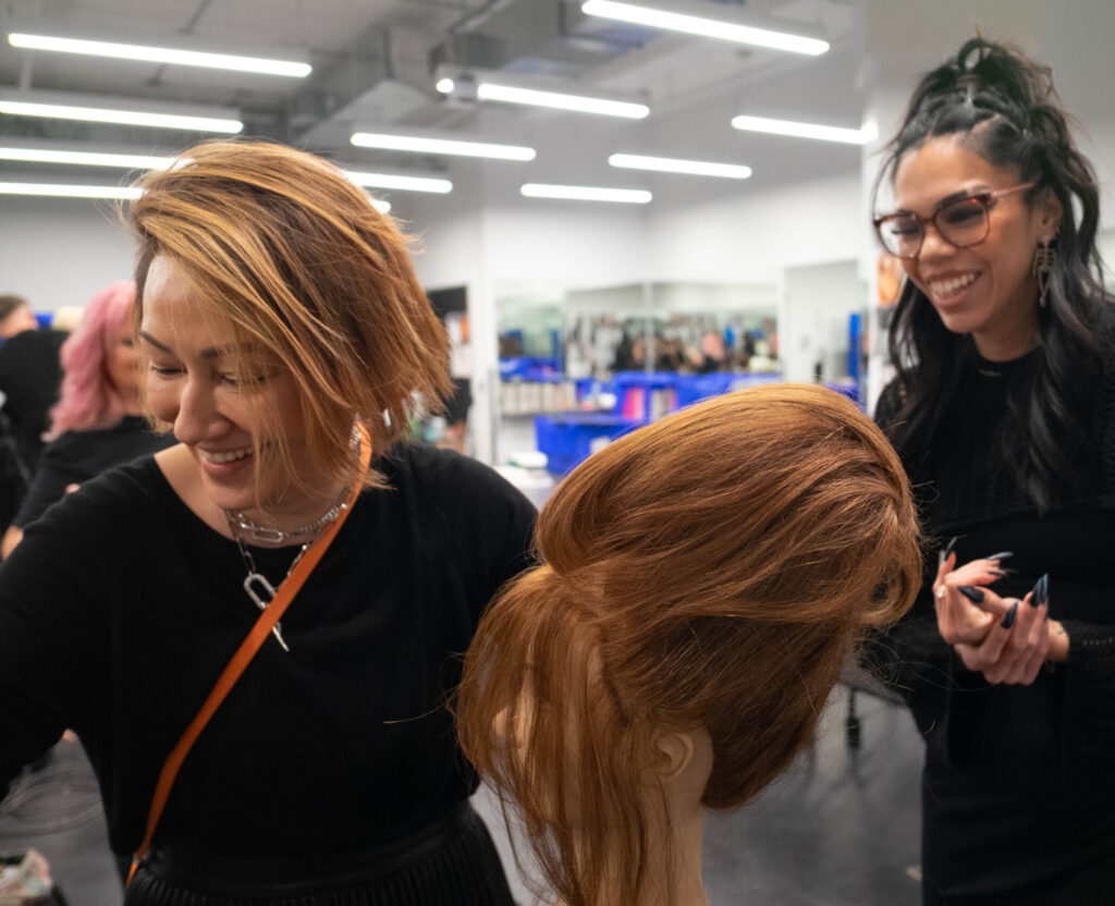 More Stylists - Group Shot of Smiling Stylist Behind the Scenes on Set