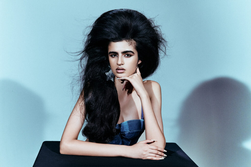 A group of models showcasing the Raw Volume Neill Collection featuring editorial Aveda hair color and high-volume styling.